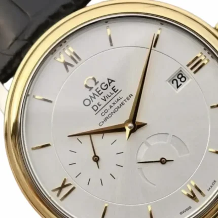 Detailed silver dial and gold Roman numerals on Omega De Ville Power Reserve replica